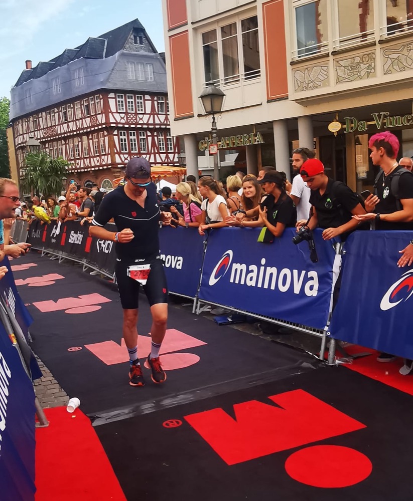 Tobias crossing a finish line
